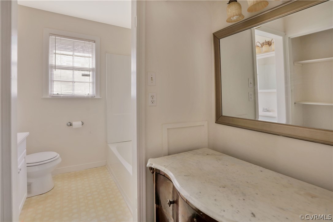 4601 Treely Road Chester, VA 23831 - Photo 18 of 27 a bathroom with a sink a toilet and a window