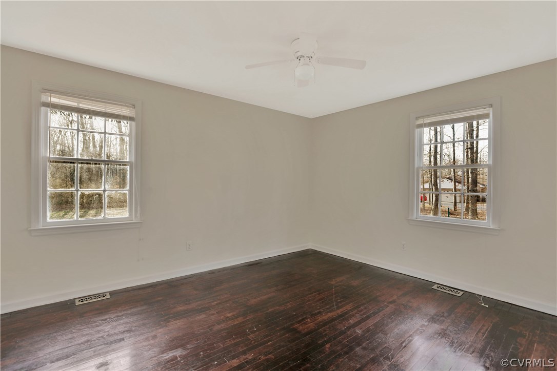 4601 Treely Road Chester, VA 23831 - Photo 19 of 27 a view of an empty room with wooden floor and a window