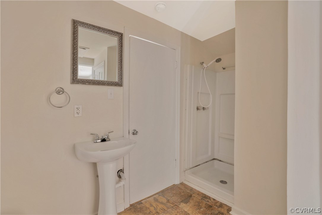 4601 Treely Road Chester, VA 23831 - Photo 20 of 27 a bathroom with a sink and mirror