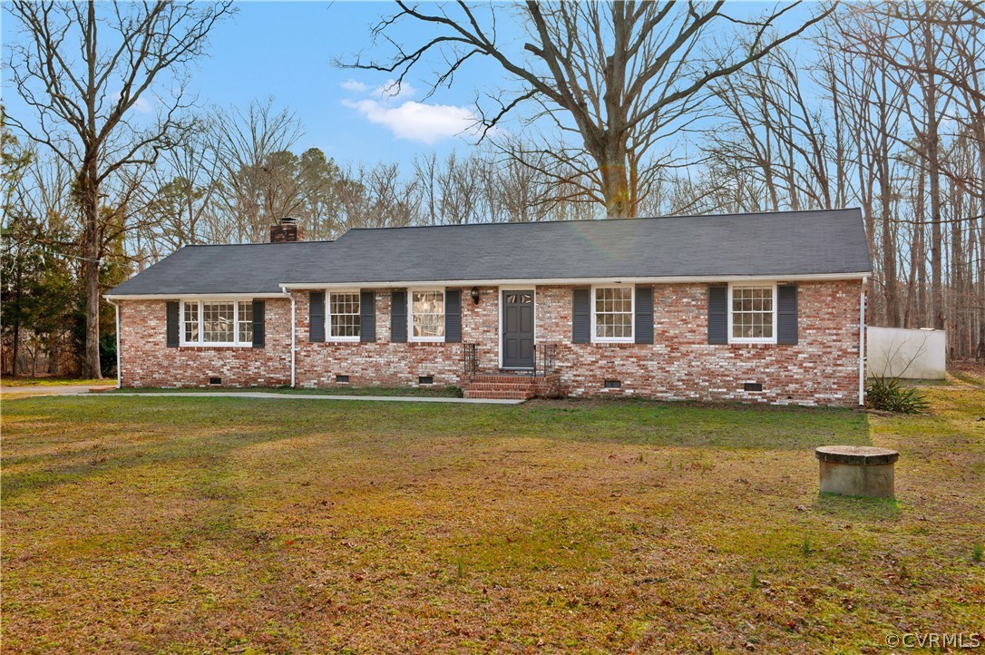 4601 Treely Road Chester, VA 23831 - Photo 2 of 27 a front view of a house with garden