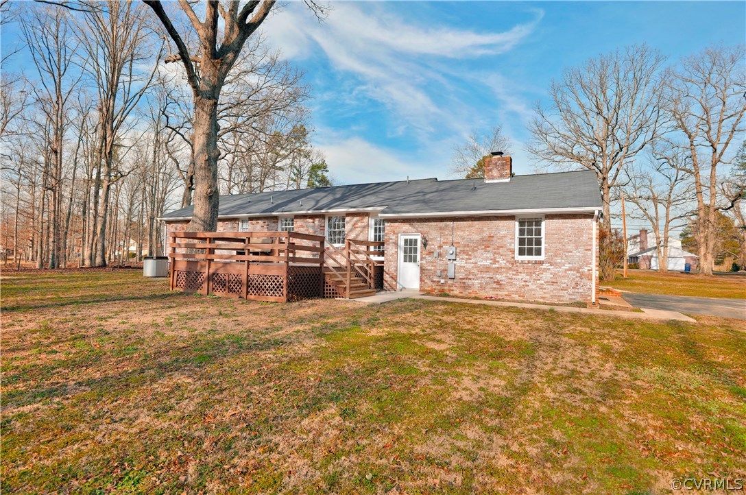 4601 Treely Road Chester, VA 23831 - Photo 24 of 27 a front view of a house with a yard and garage