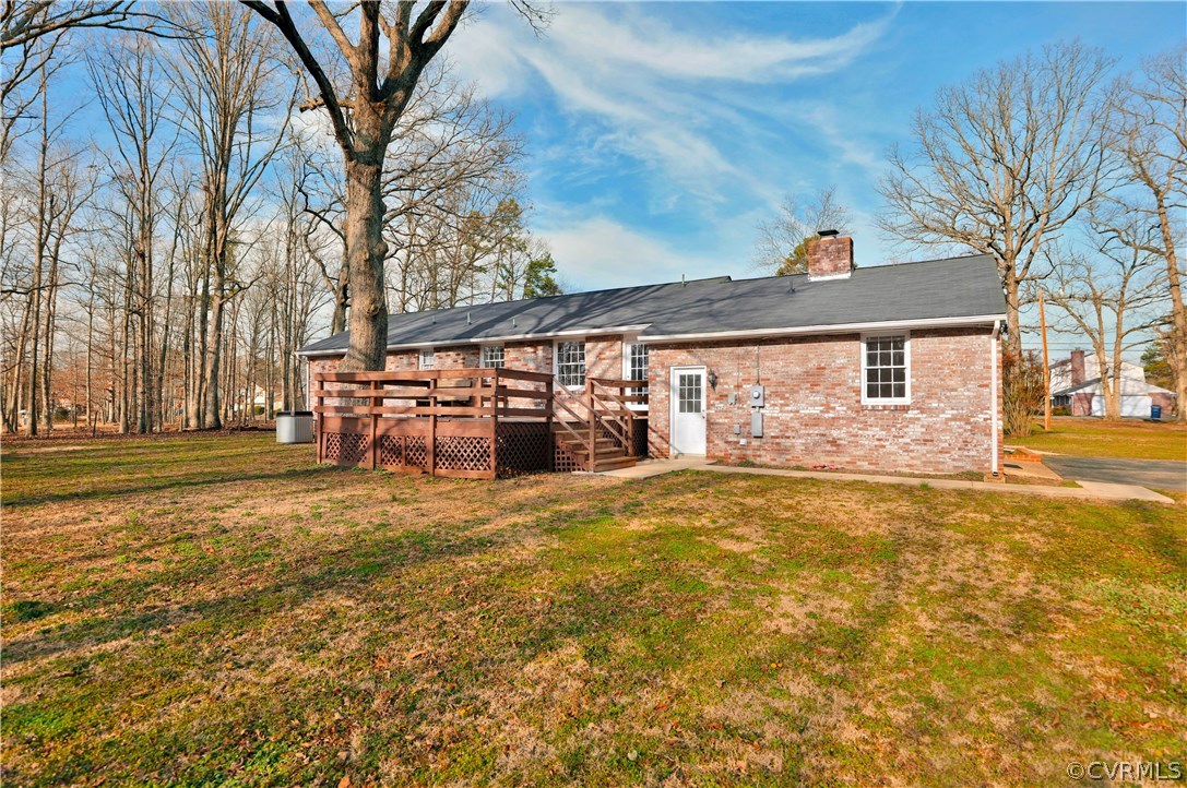 4601 Treely Road Chester, VA 23831 - Photo 25 of 27 a front view of a house with a yard and garage