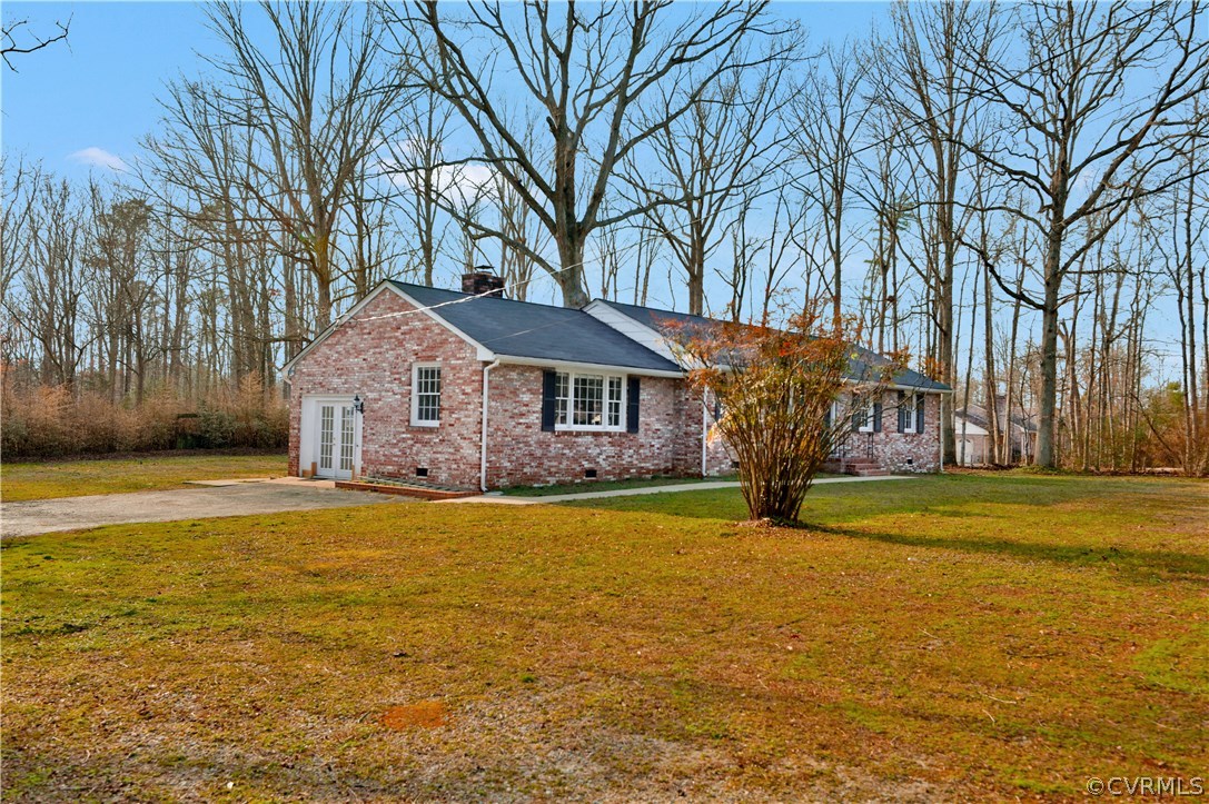 4601 Treely Road Chester, VA 23831 - Photo 3 of 27 a front view of house with yard and trees