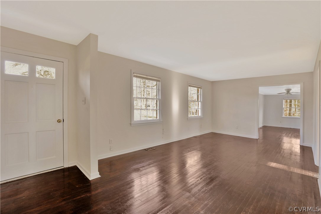 4601 Treely Road Chester, VA 23831 - Photo 4 of 27 an empty room with wooden floor and windows