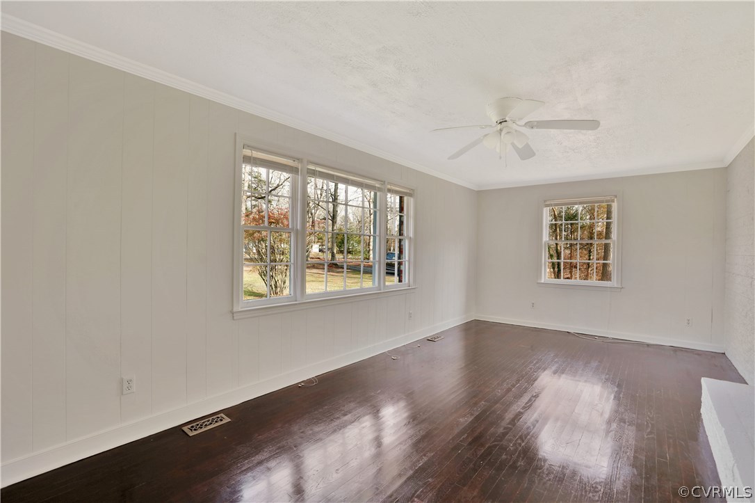 4601 Treely Road Chester, VA 23831 - Photo 8 of 27 a view of an empty room with wooden floor and a window