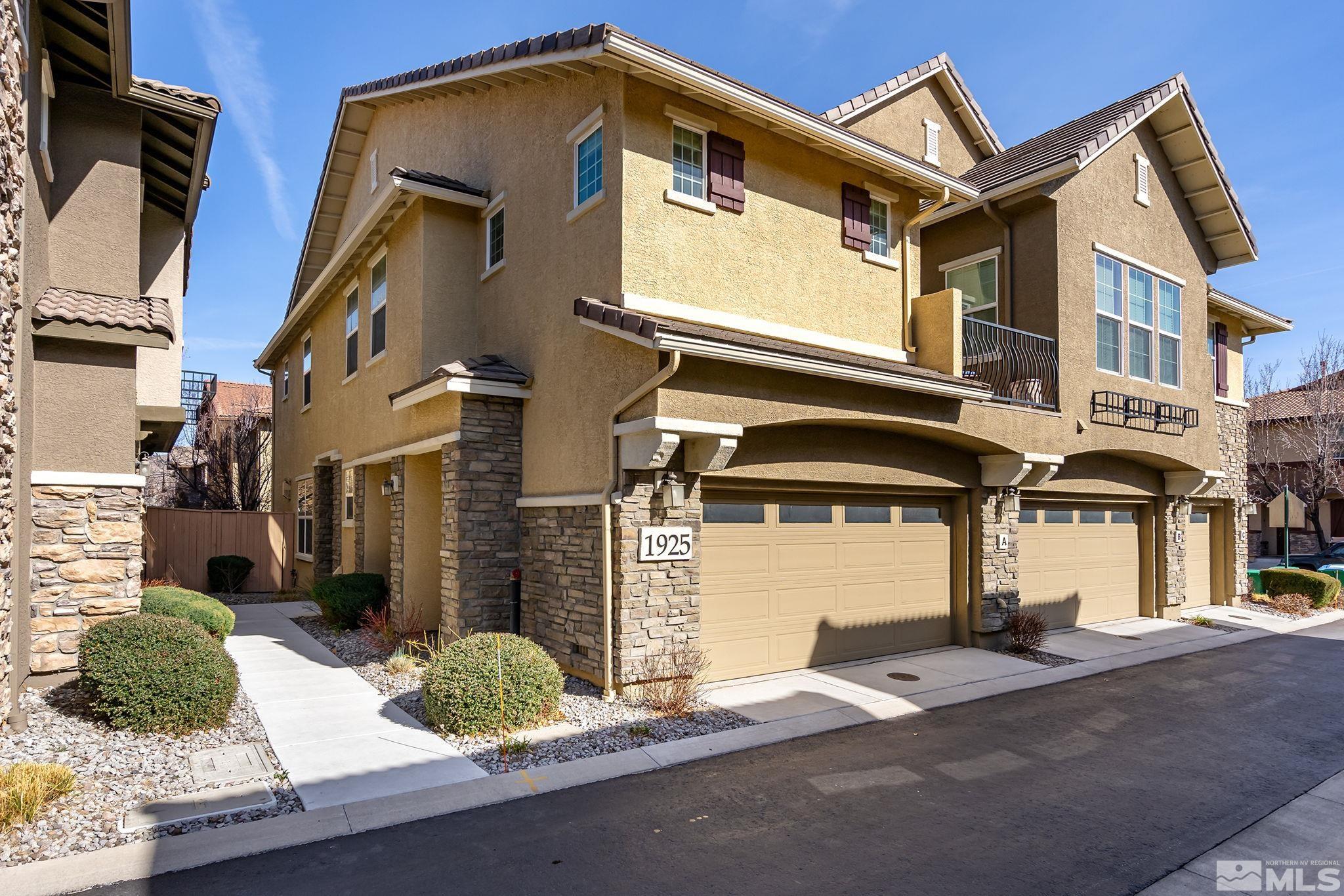 1925 Wind Ranch Road, Unit A Reno, NV 89521 - Photo 1 of 21 a front view of a house with garden
