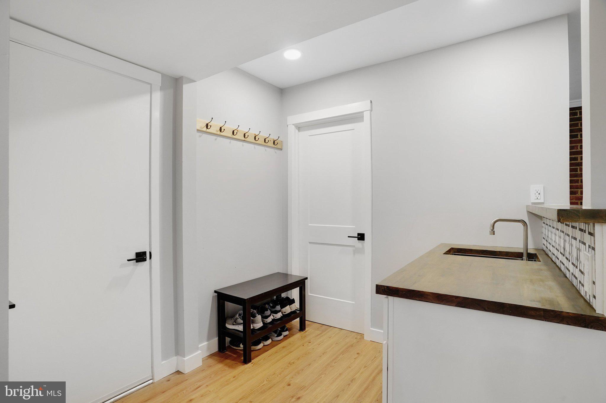 7628 Gralnick Place Springfield, VA 22153 - Photo 23 of 60 Bar Area leading to Main Level Laundry Room