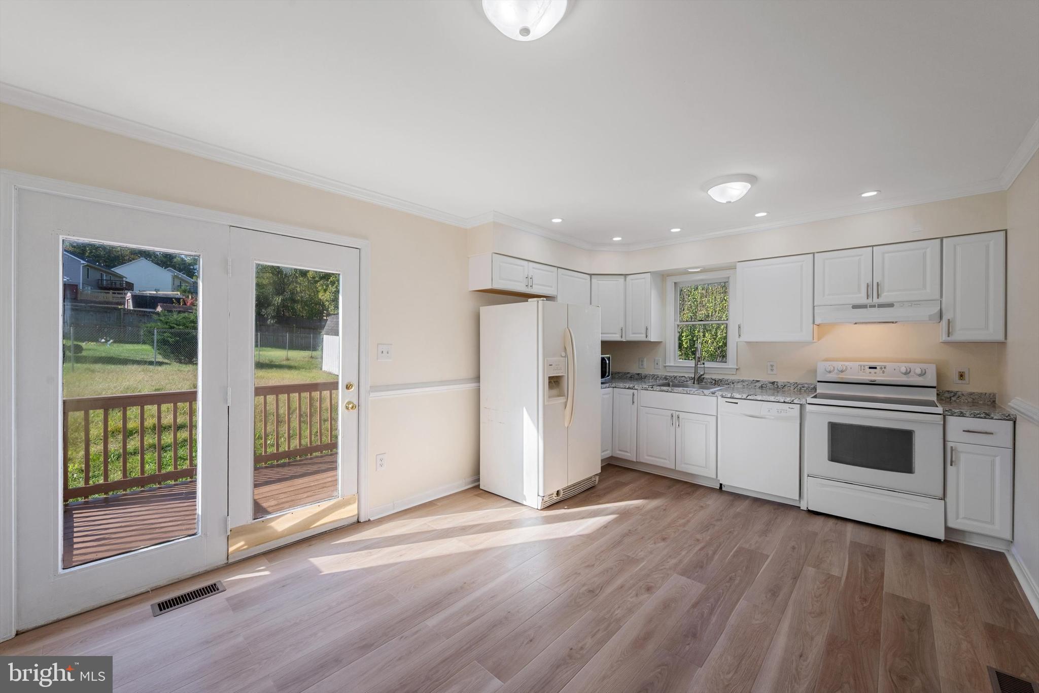 852 Morgan Place Front Royal, VA 22630 - Photo 14 of 36 a kitchen with stainless steel appliances a refrigerator and a stove top oven