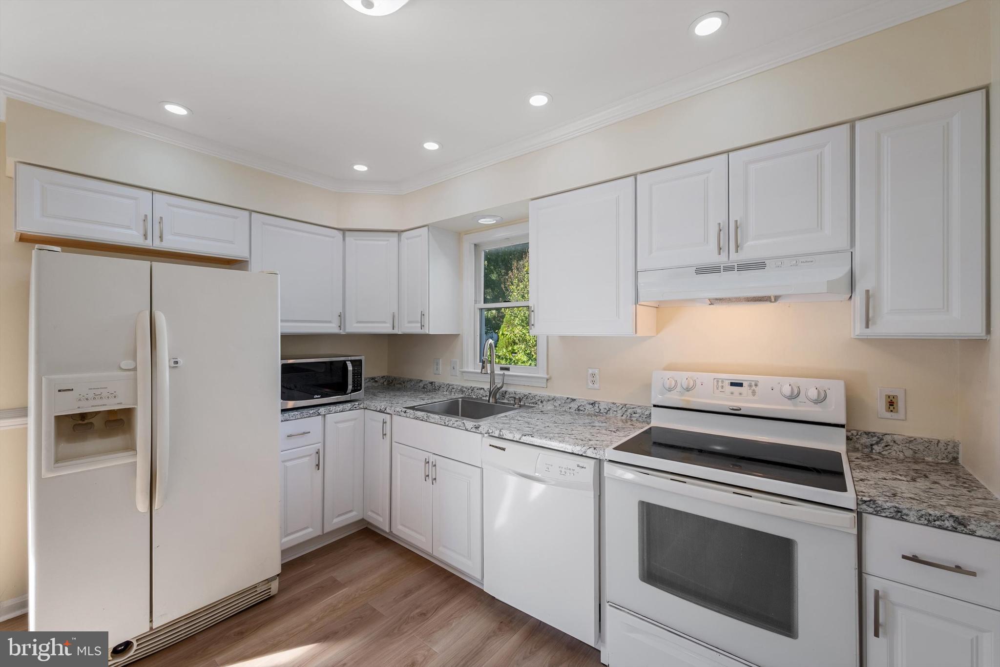 852 Morgan Place Front Royal, VA 22630 - Photo 15 of 36 a kitchen with granite countertop white cabinets and white appliances