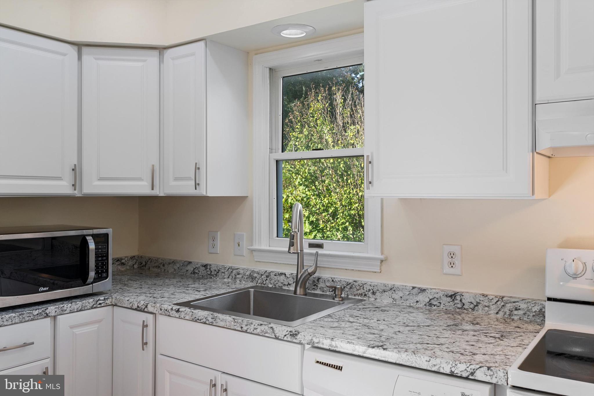 852 Morgan Place Front Royal, VA 22630 - Photo 16 of 36 a kitchen with granite countertop a sink and a stove