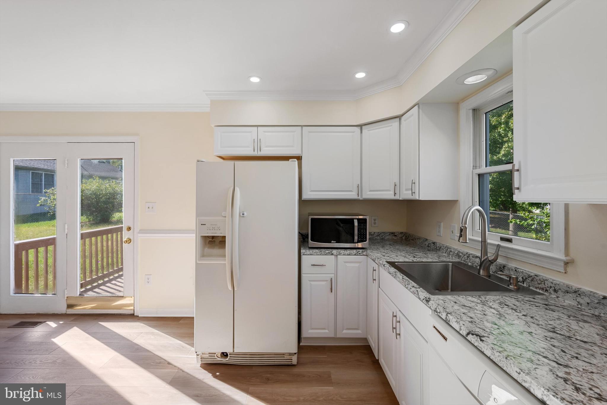 852 Morgan Place Front Royal, VA 22630 - Photo 17 of 36 a kitchen with a refrigerator sink and cabinets