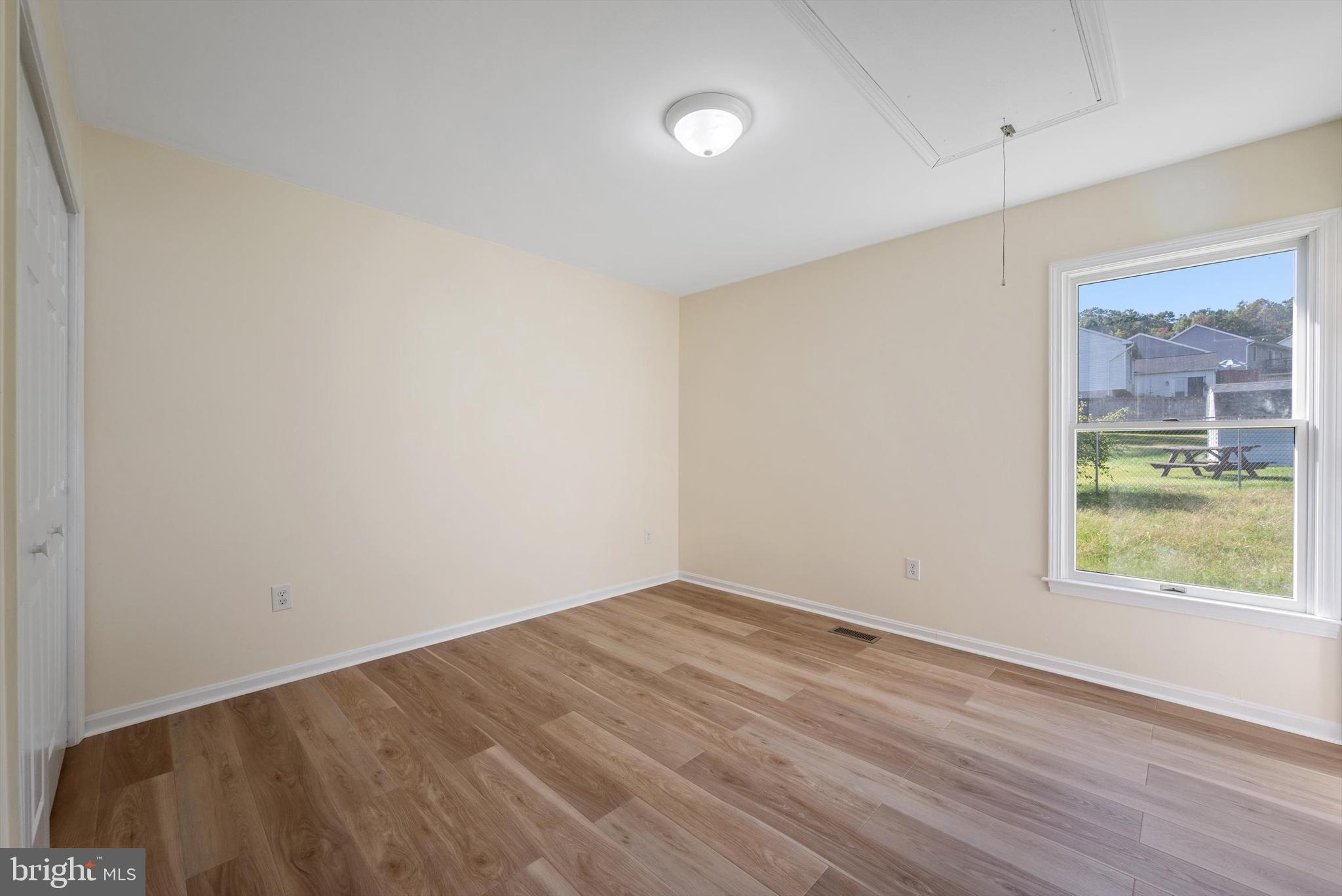 852 Morgan Place Front Royal, VA 22630 - Photo 25 of 36 an empty room with wooden floor and windows