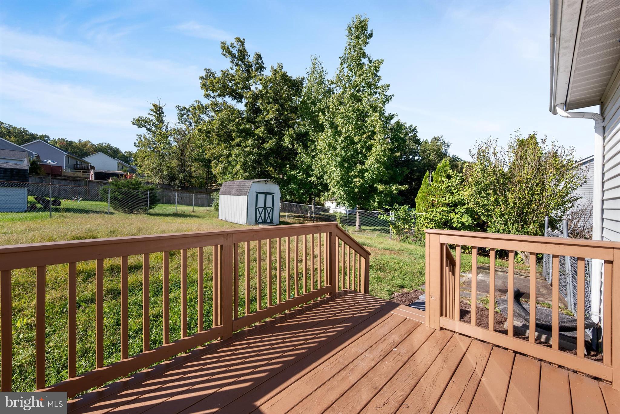 852 Morgan Place Front Royal, VA 22630 - Photo 30 of 36 a view of wooden deck and a yard with wooden fence