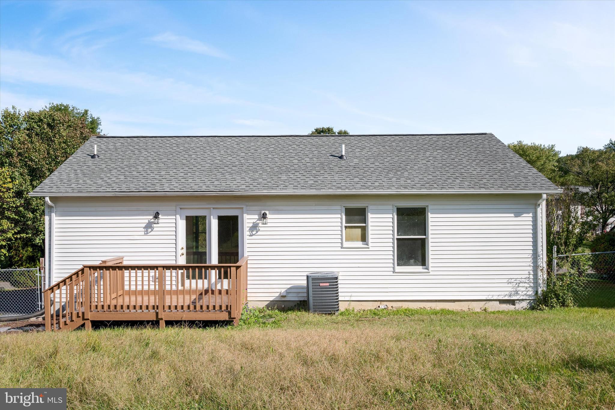 852 Morgan Place Front Royal, VA 22630 - Photo 35 of 36 a view of a house with a yard and deck