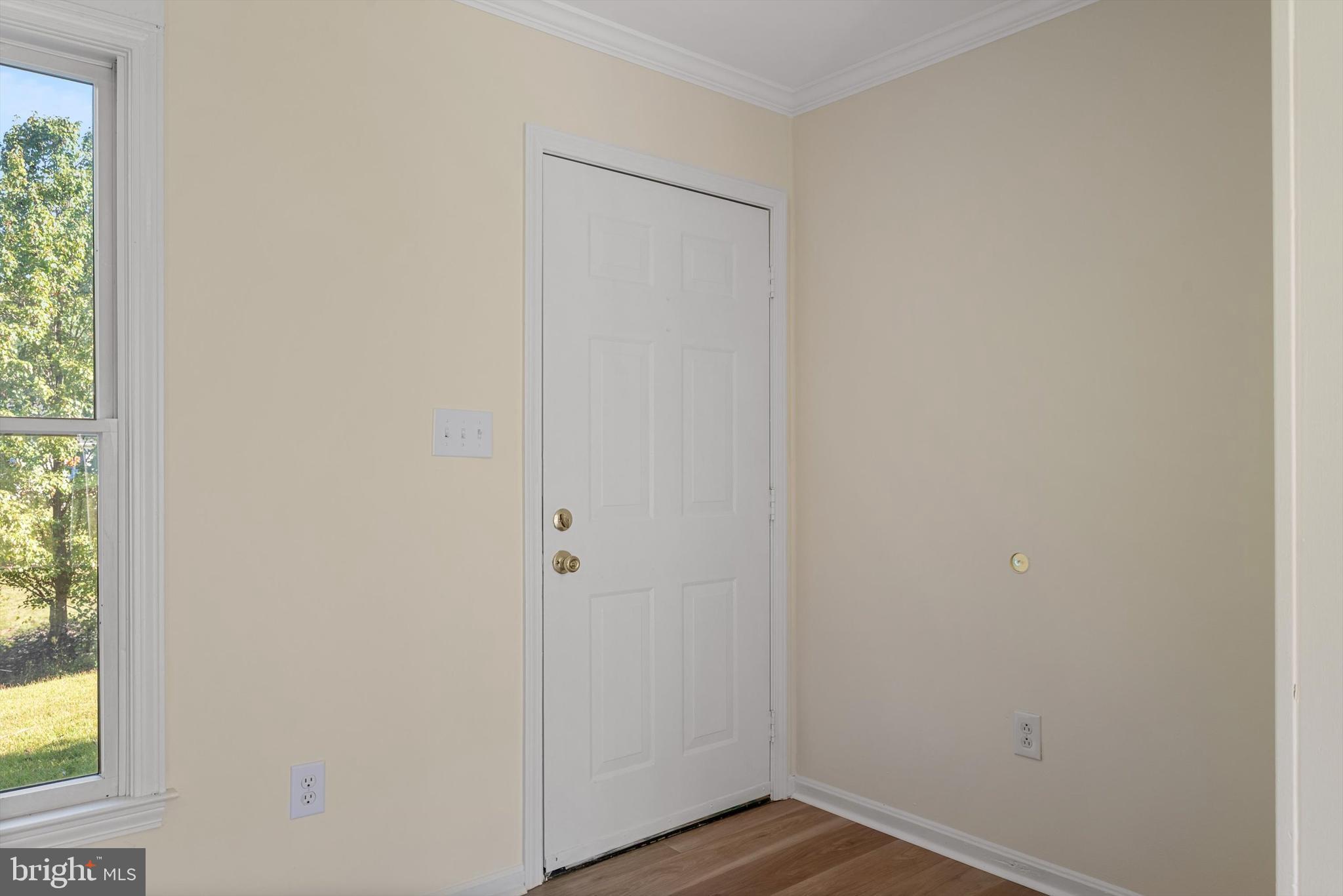 852 Morgan Place Front Royal, VA 22630 - Photo 6 of 36 a view of a small space with wooden floor and a window