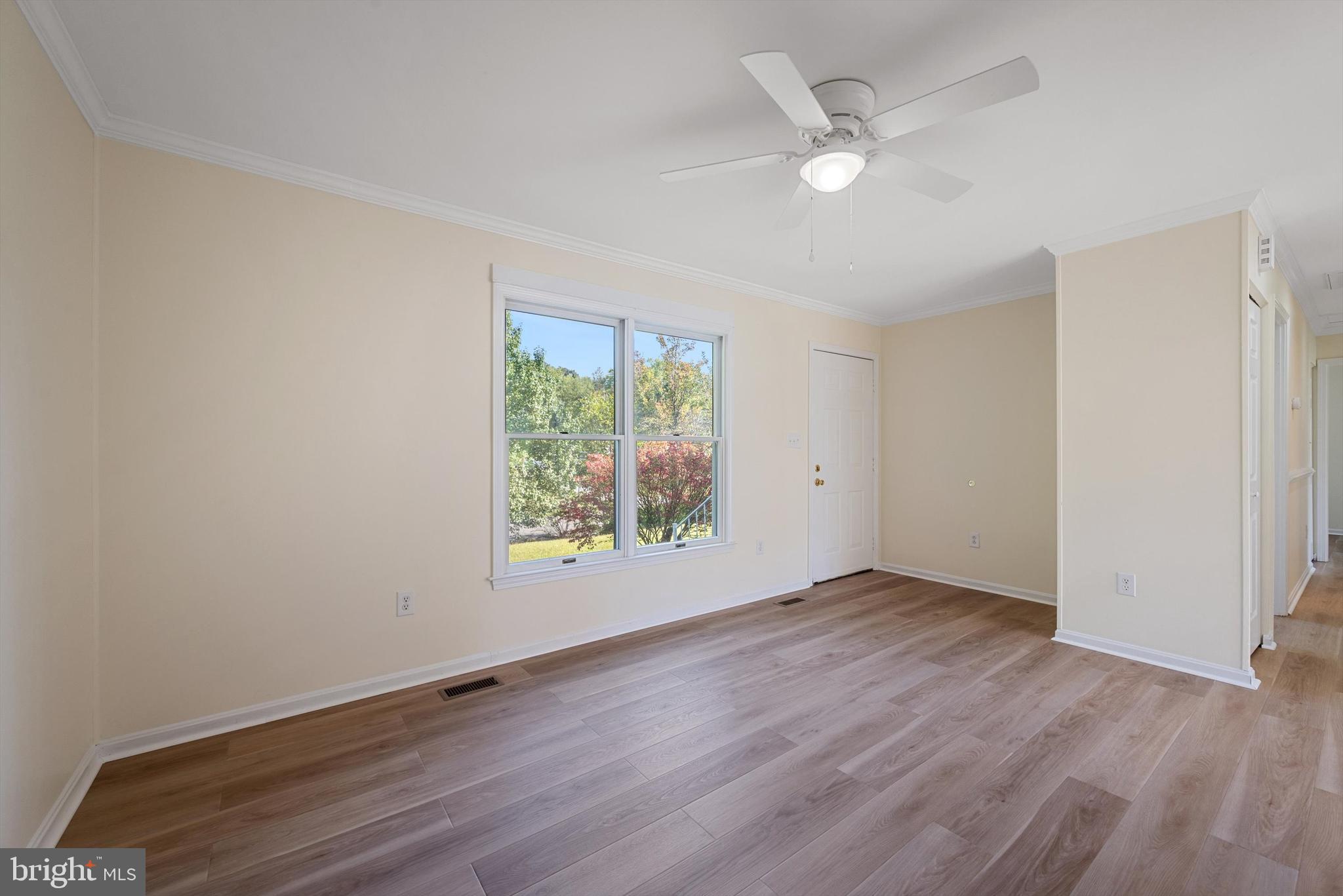 852 Morgan Place Front Royal, VA 22630 - Photo 9 of 36 an empty room with wooden floor and windows