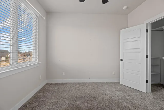 a view of an empty room with a window