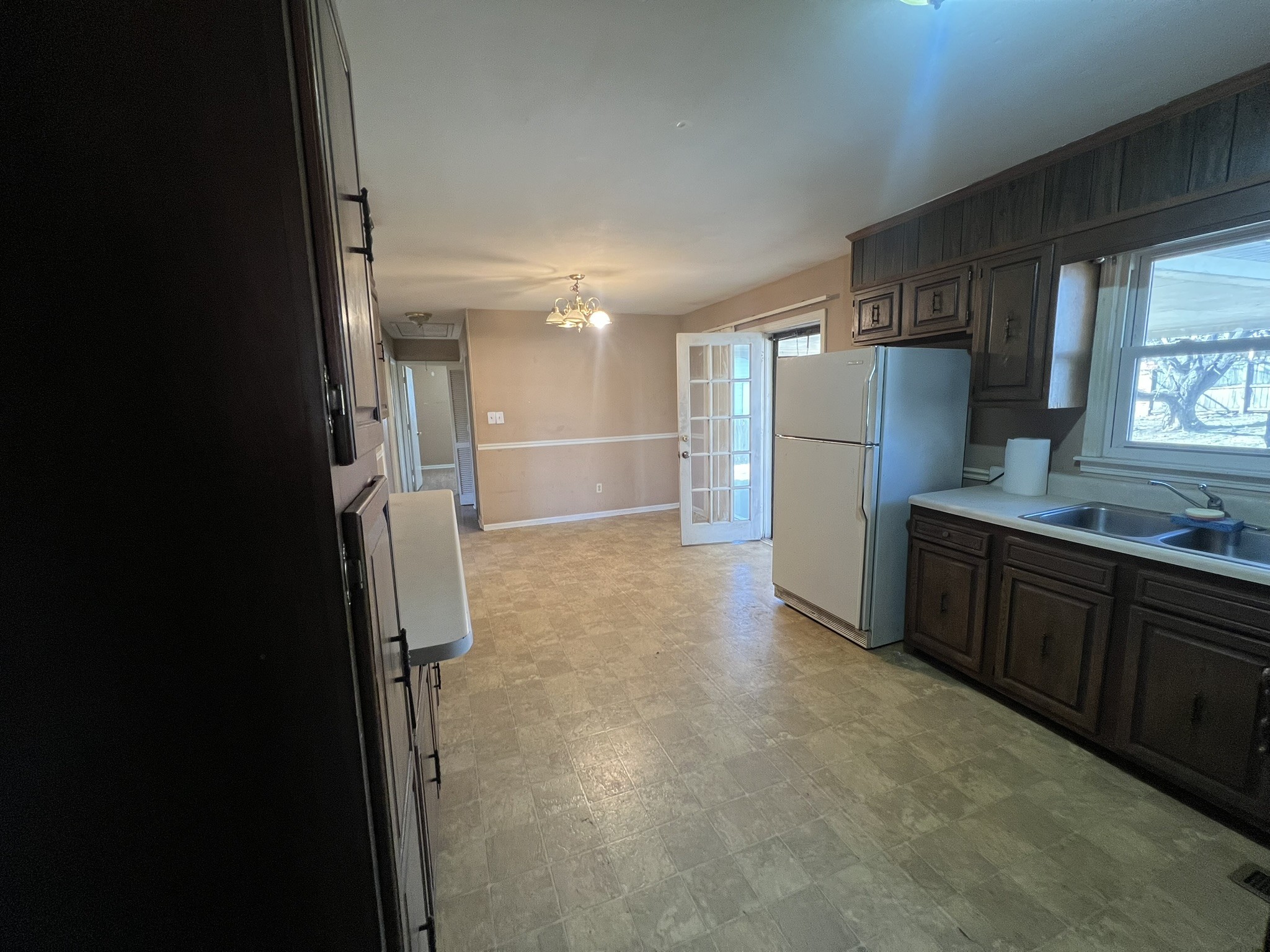 442 Rodney Street Gallatin, TN 37066 - Photo 11 of 21 a kitchen with refrigerator and cabinets