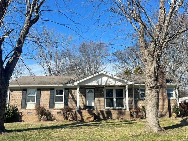 a front view of a house with swimming pool and glass windows