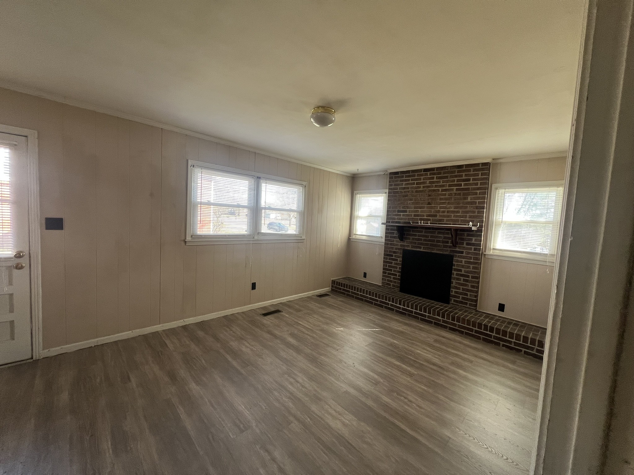 442 Rodney Street Gallatin, TN 37066 - Photo 2 of 21 an empty room with windows a fireplace