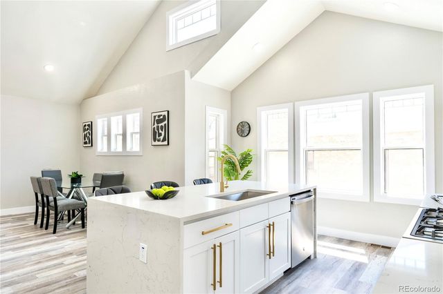 a living room with kitchen island furniture and a window