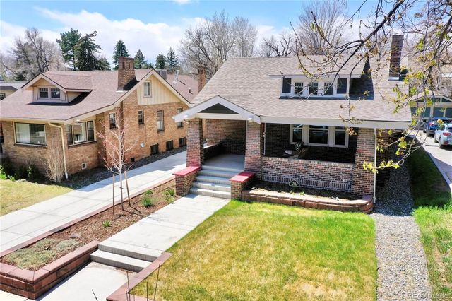 a aerial view of a house with a yard