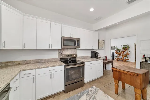 a bedroom with a bed and a cabinets