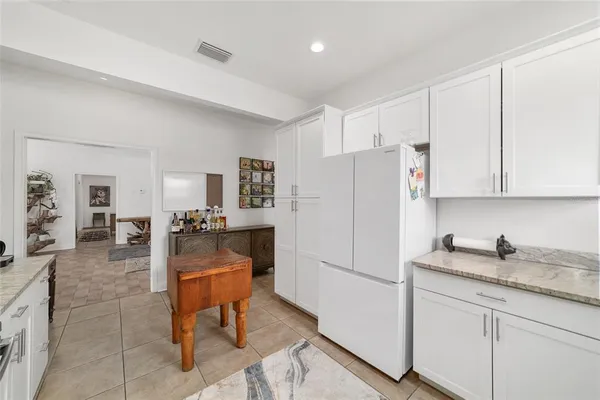 a bedroom with a bed and a cabinets