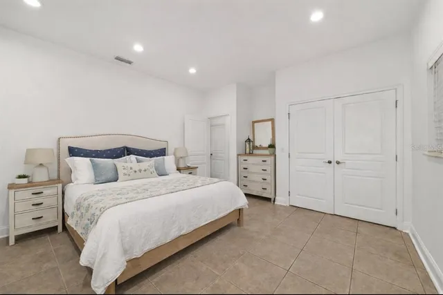 an aerial view of a house with swimming pool and mountain view