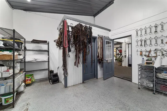 an aerial view of a house with big yard and large trees