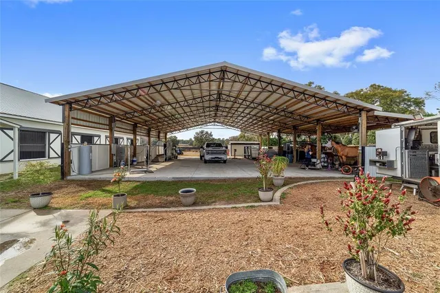 an aerial view of a house with a yard lake view and mountain view