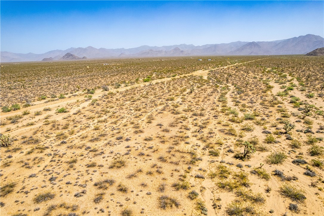 0 East Arroyo Road Yucca, AZ 86438 - Photo 13 of 25 Expansive desert landscape with a clear, vast sky overhead