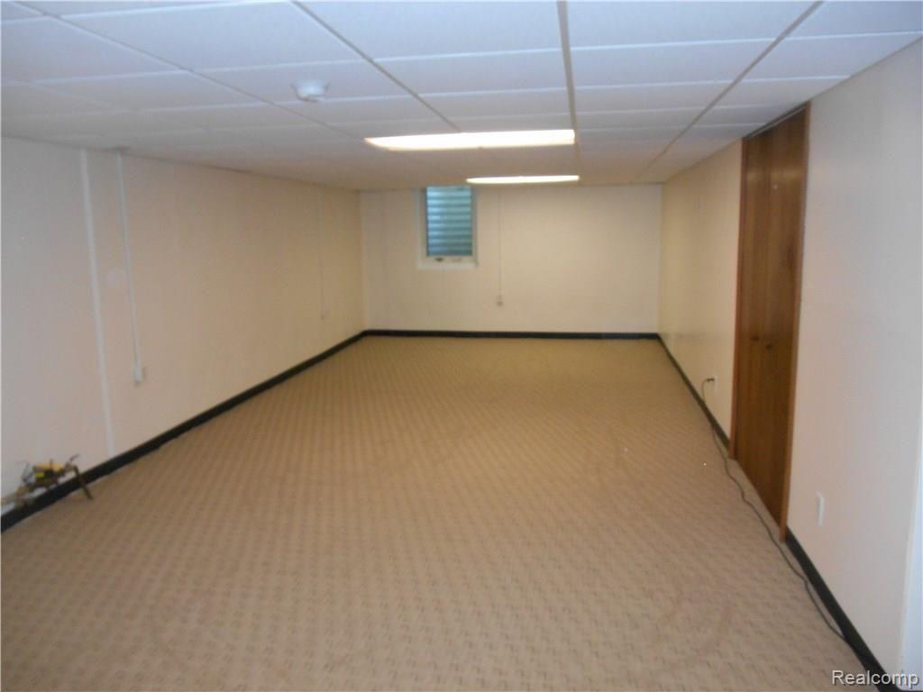 25754 Peter Kaltz Road Warren, MI 48091 - Photo 46 of 68 ADDITIONAL BASEMENT VIEW SHOWING DOORS TO SPACIOUS UTILITY ROOM