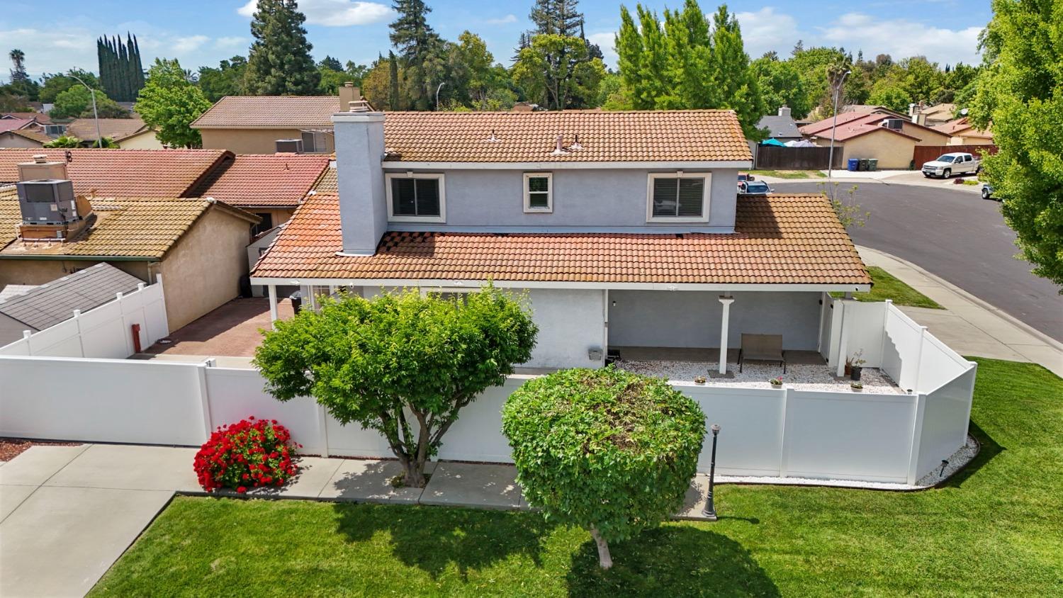 a aerial view of a house with a yard patio and swimming pool
