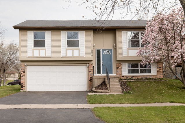 225 Huntingwood Road Matteson, IL 60443 - Photo 1 of 14 a front view of a house with garden
