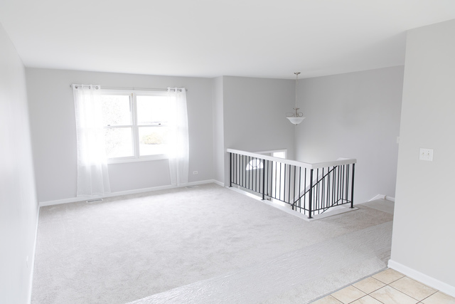 225 Huntingwood Road Matteson, IL 60443 - Photo 4 of 14 a view of empty room with a window