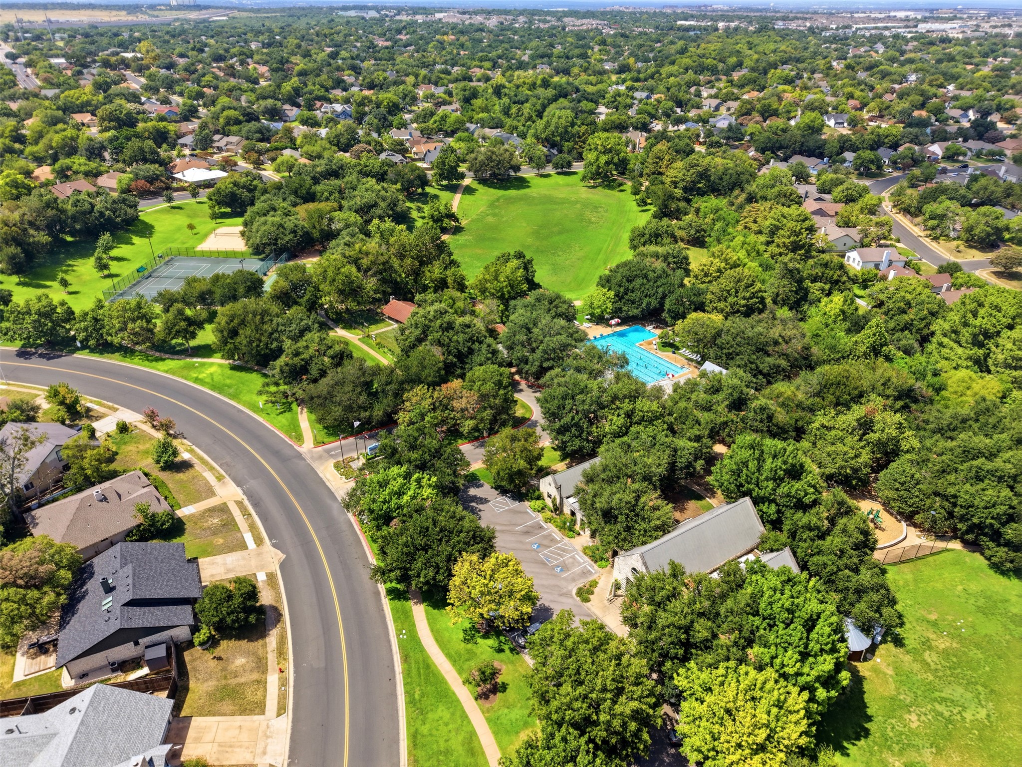 15207 Natural Spring Way Austin, TX 78728 - Photo 38 of 40 Enjoy two pools, parks, playground, year round community events, sports courts and fields, and more.