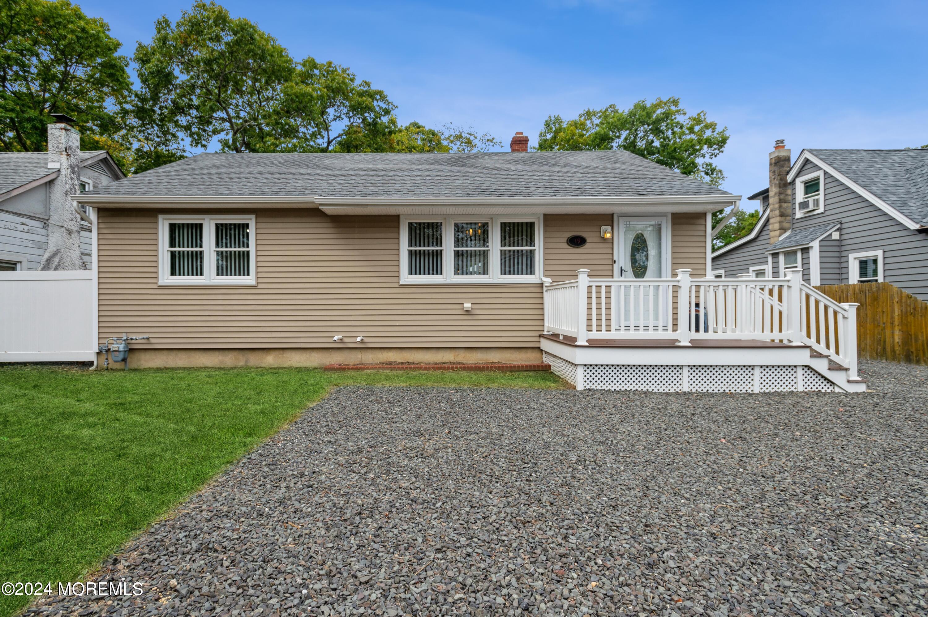19 Holly Road Brick, NJ 08723 - Photo 1 of 16 a front view of a house with a garden