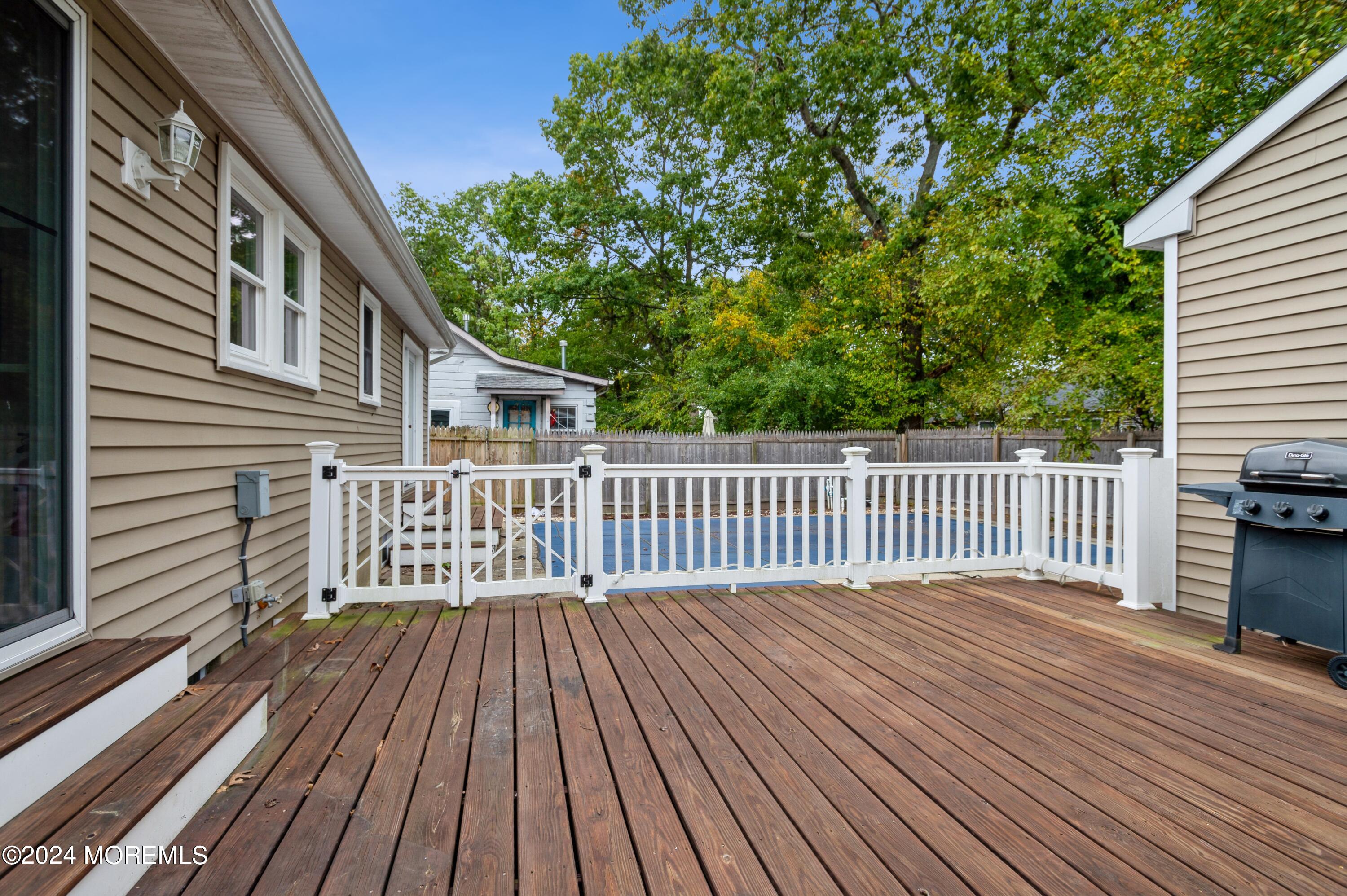 19 Holly Road Brick, NJ 08723 - Photo 13 of 16 a balcony with a wooden floor