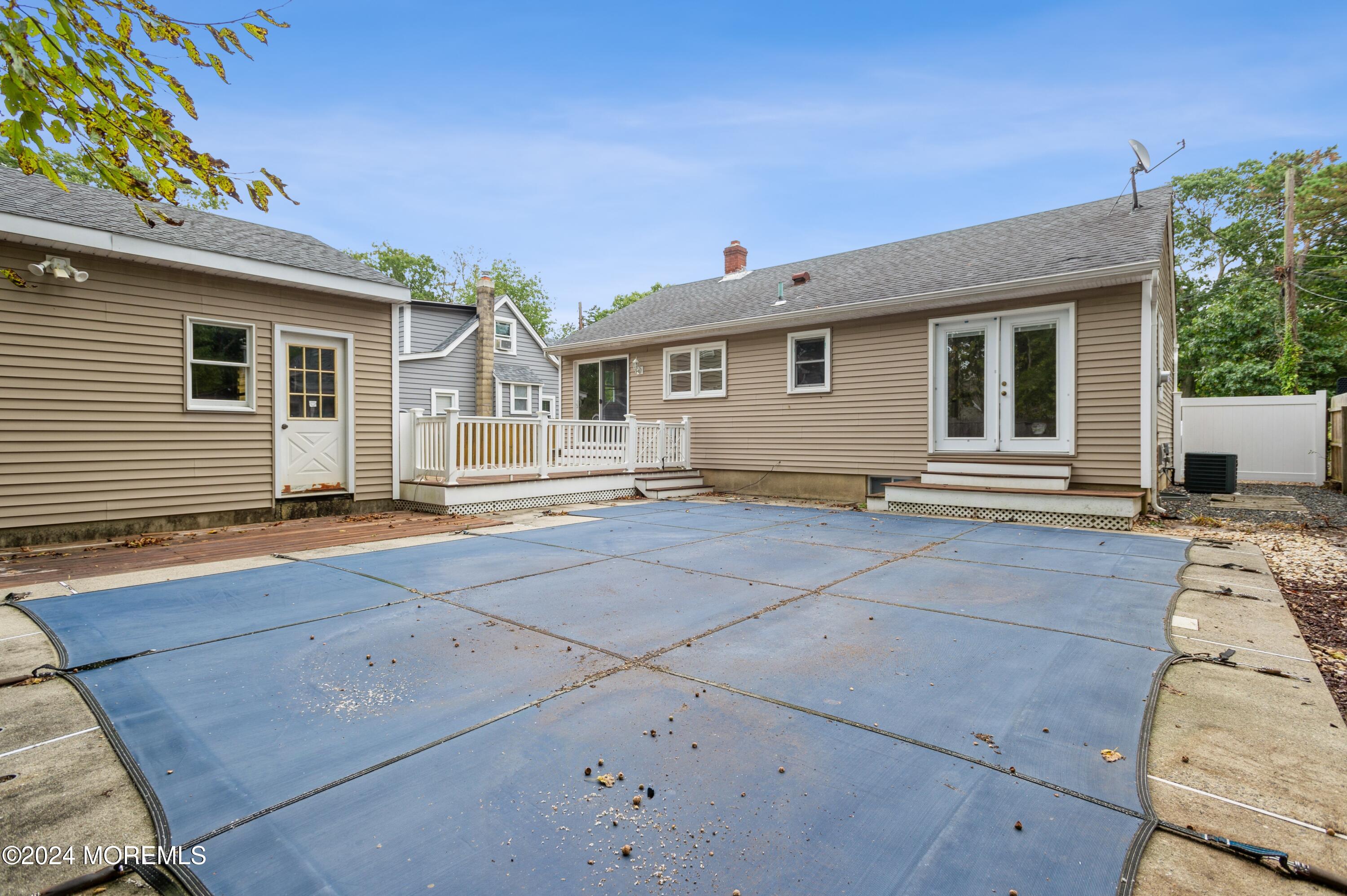 19 Holly Road Brick, NJ 08723 - Photo 15 of 16 a front view of house with yard