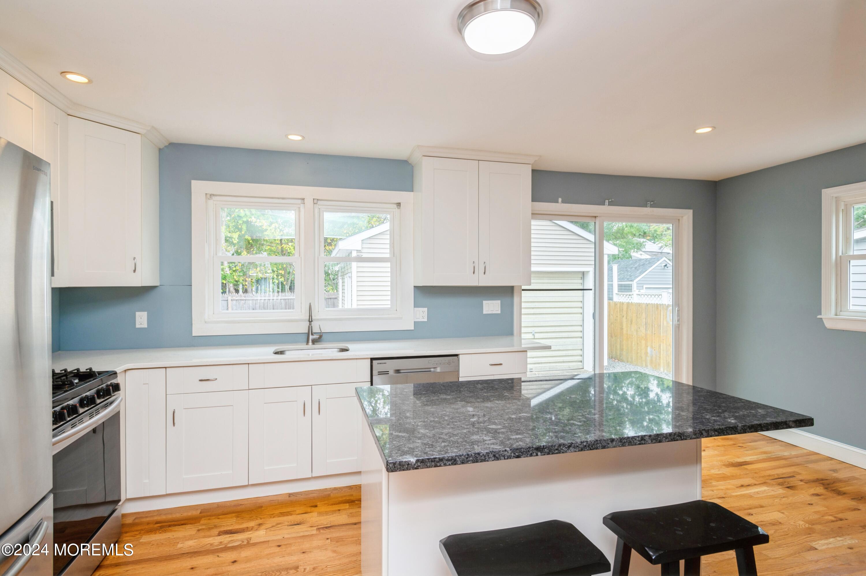 19 Holly Road Brick, NJ 08723 - Photo 5 of 16 a kitchen with a sink cabinets and window