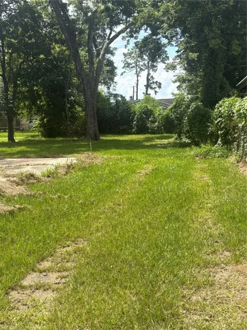 a view of outdoor space with deck and yard