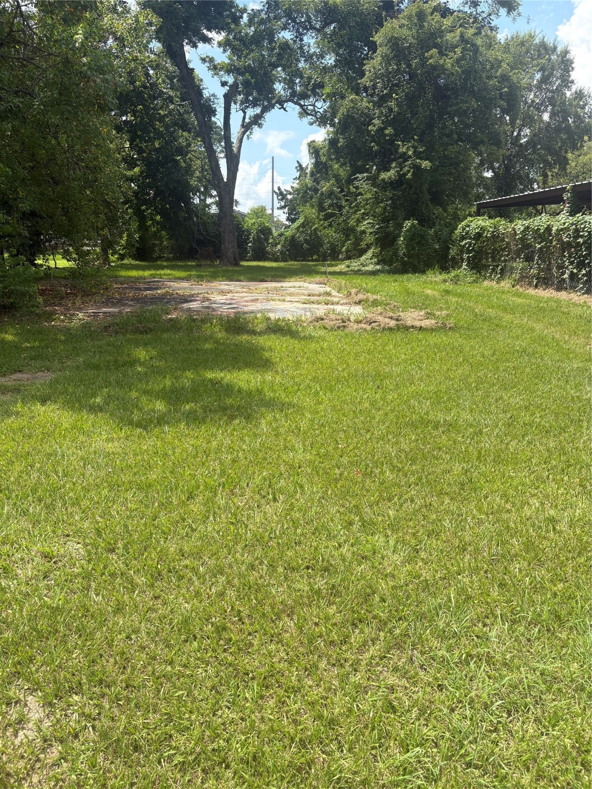 2031 Delaware Street Beaumont, TX 77703 - Photo 8 of 8 a view of a yard with an outdoor space