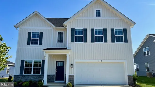 a view of a brick house with large windows