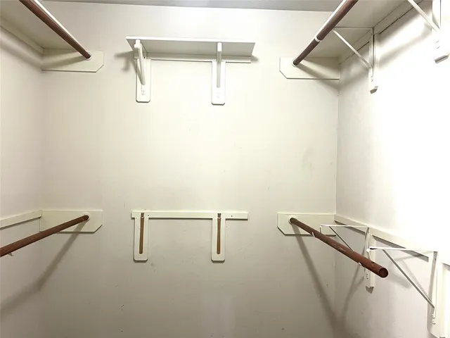 a view of a room with racks on the wall