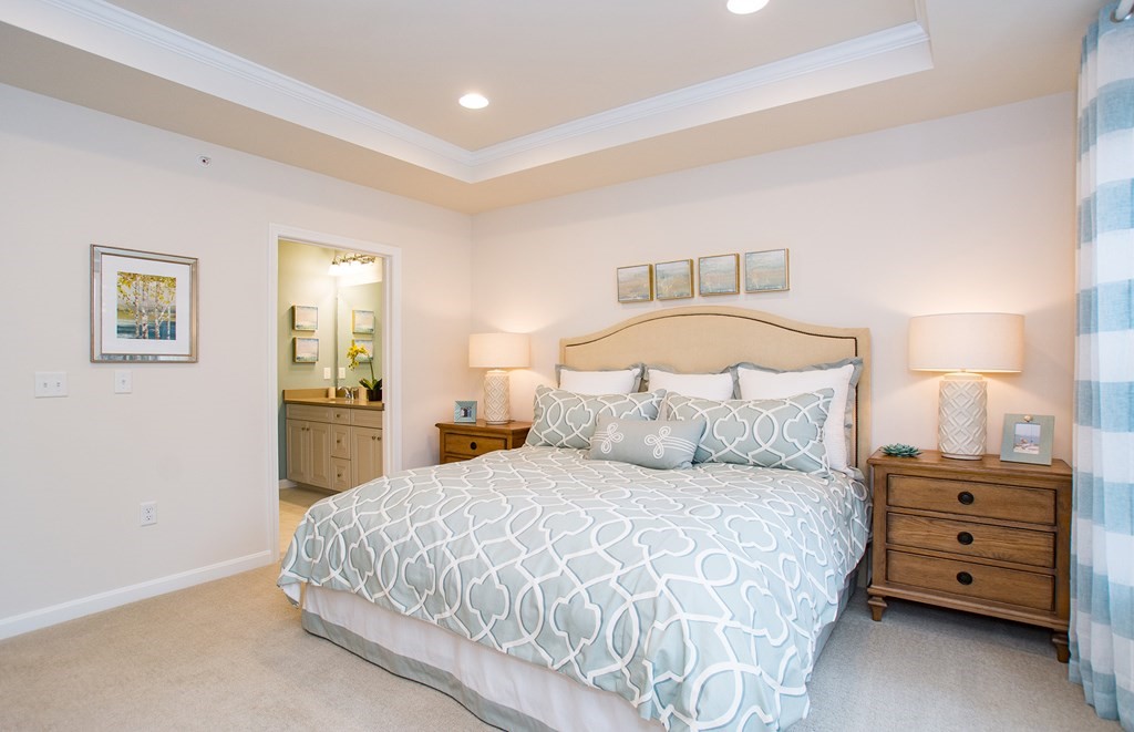 52 Sienna, Unit 47 Upton, MA 01568 - Photo 11 of 17 a bedroom with a bed and a night stand