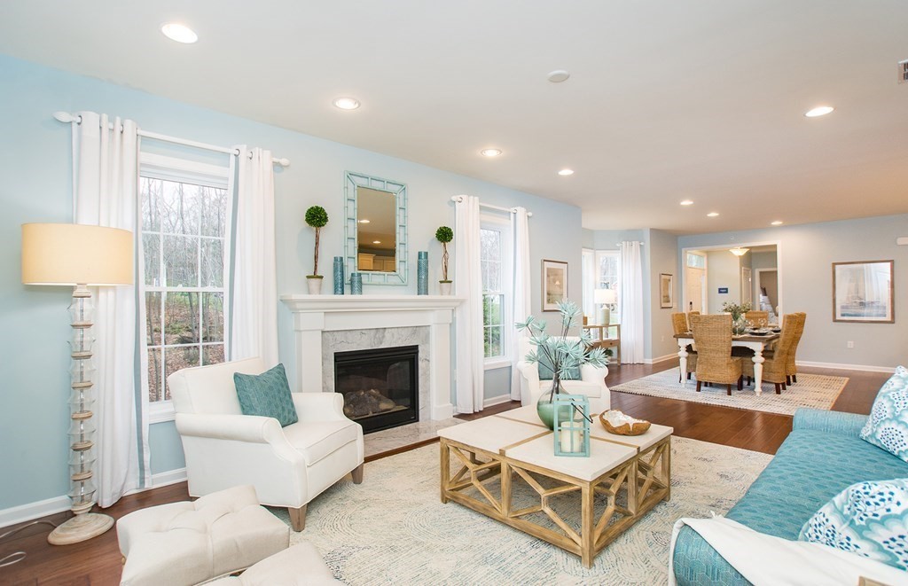 52 Sienna, Unit 47 Upton, MA 01568 - Photo 7 of 17 a living room with furniture fireplace and a table