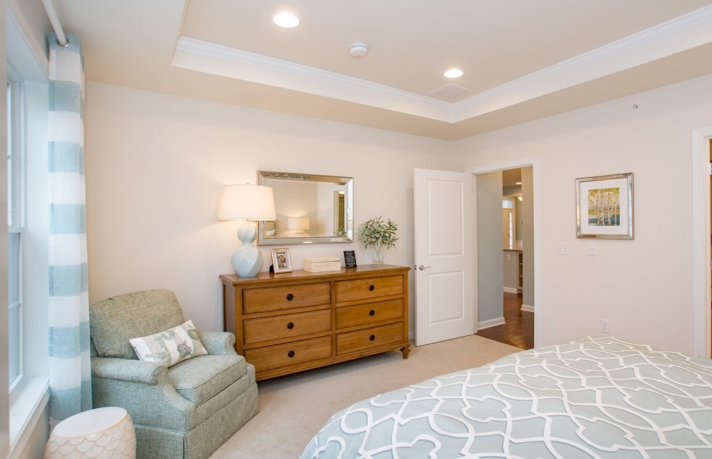 52 Sienna, Unit 47 Upton, MA 01568 - Photo 10 of 17 a bedroom with a bed and furniture