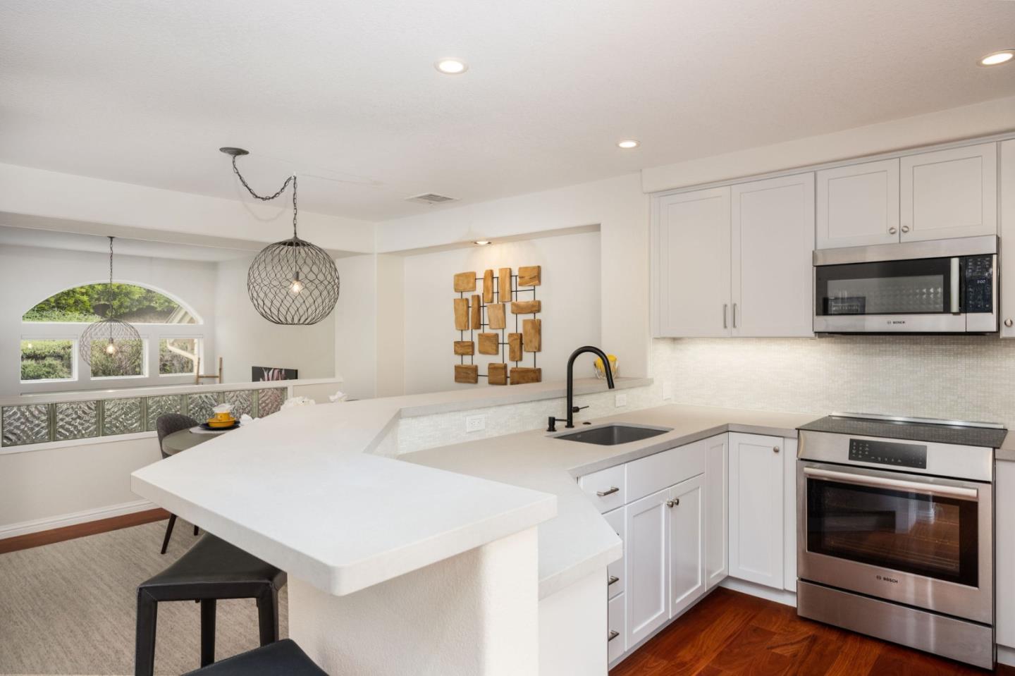 12 Patrick Way Half Moon Bay, CA 94019 - Photo 12 of 36 a kitchen with sink a microwave and cabinets