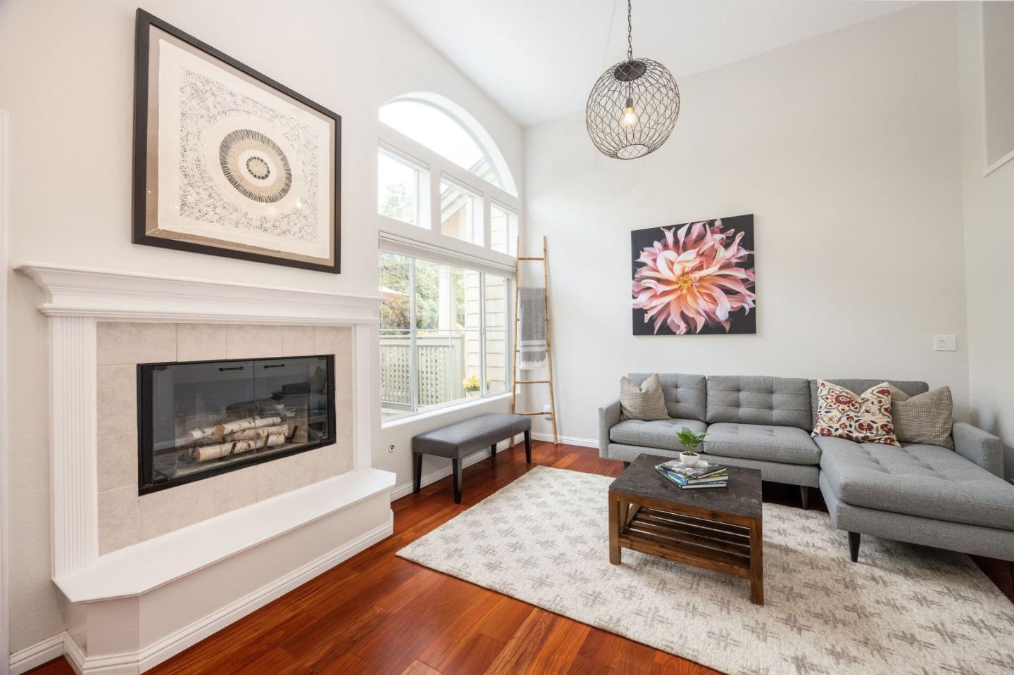 12 Patrick Way Half Moon Bay, CA 94019 - Photo 5 of 36 a living room with furniture a clock and a fireplace